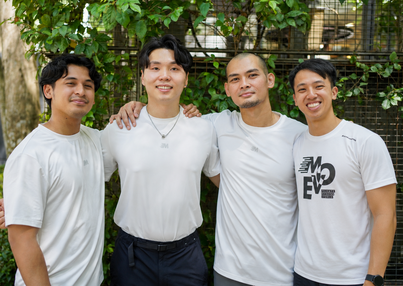 Four MOVE team members standing together outdoors